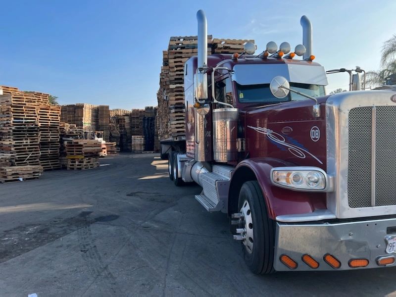 Semi truck with pallets at freight yard